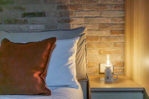 Dormire a cento - mansarda open space, particolare cuscino e letto